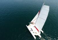 trimaran sailing aerial photo of mast with flatten main sail